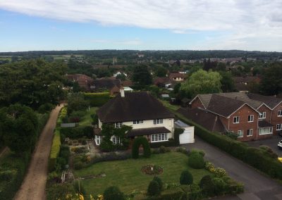 Drone image of roof repairs on heritage property in Surrey.