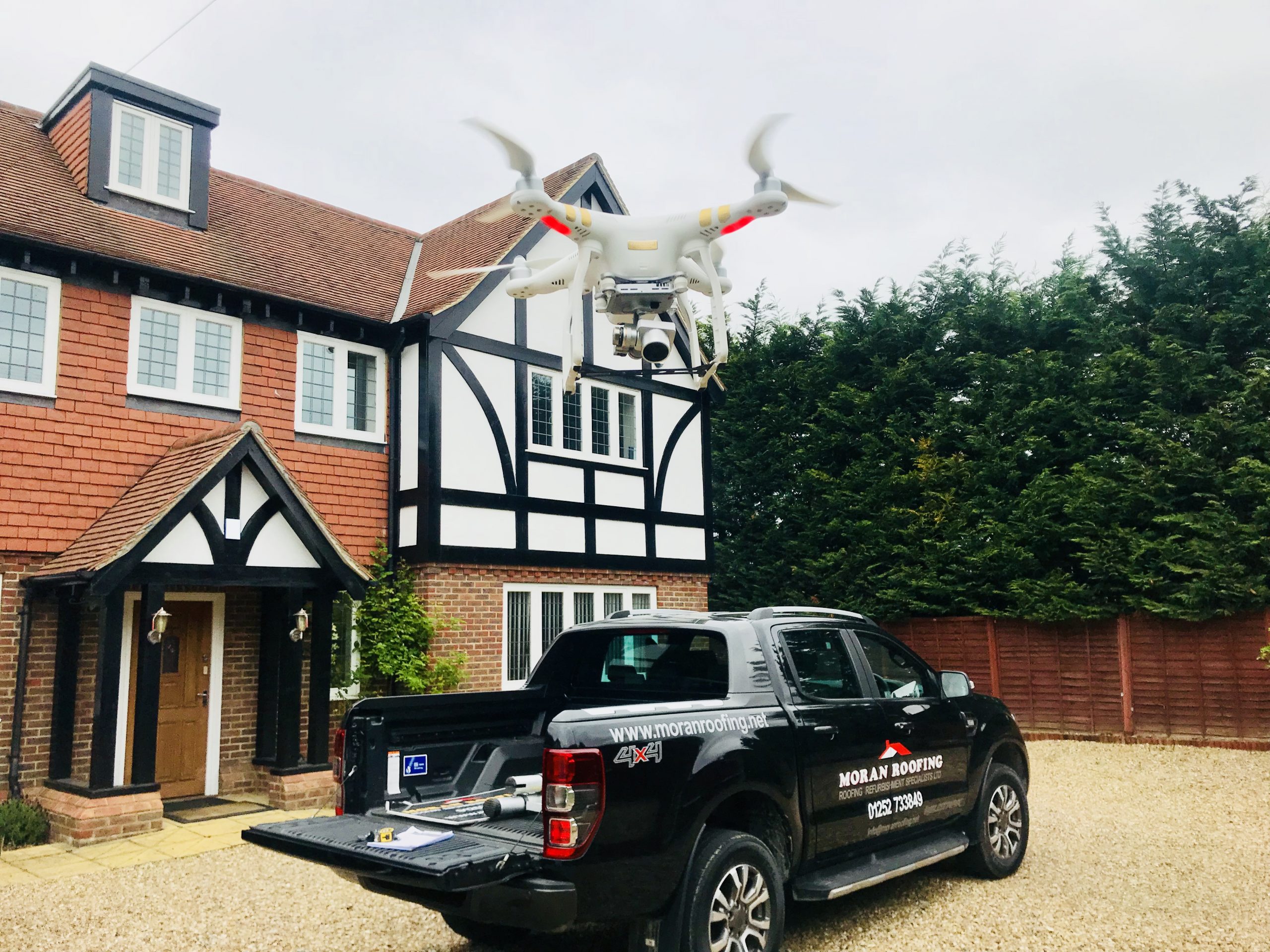 Drone and Moran Roofing truck, used for roof surveys